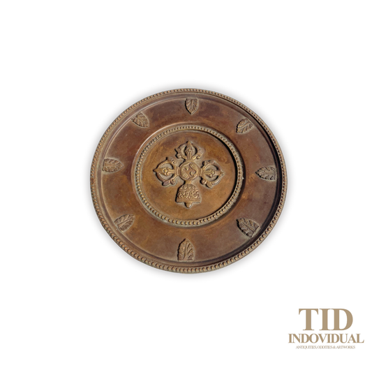 Rare Vintage Antique Tibetan-style brass or copper wall hanging plate featuring a large central motif known as a Vishvavajra or crossed vajra (also called double dorje in Tibetan)