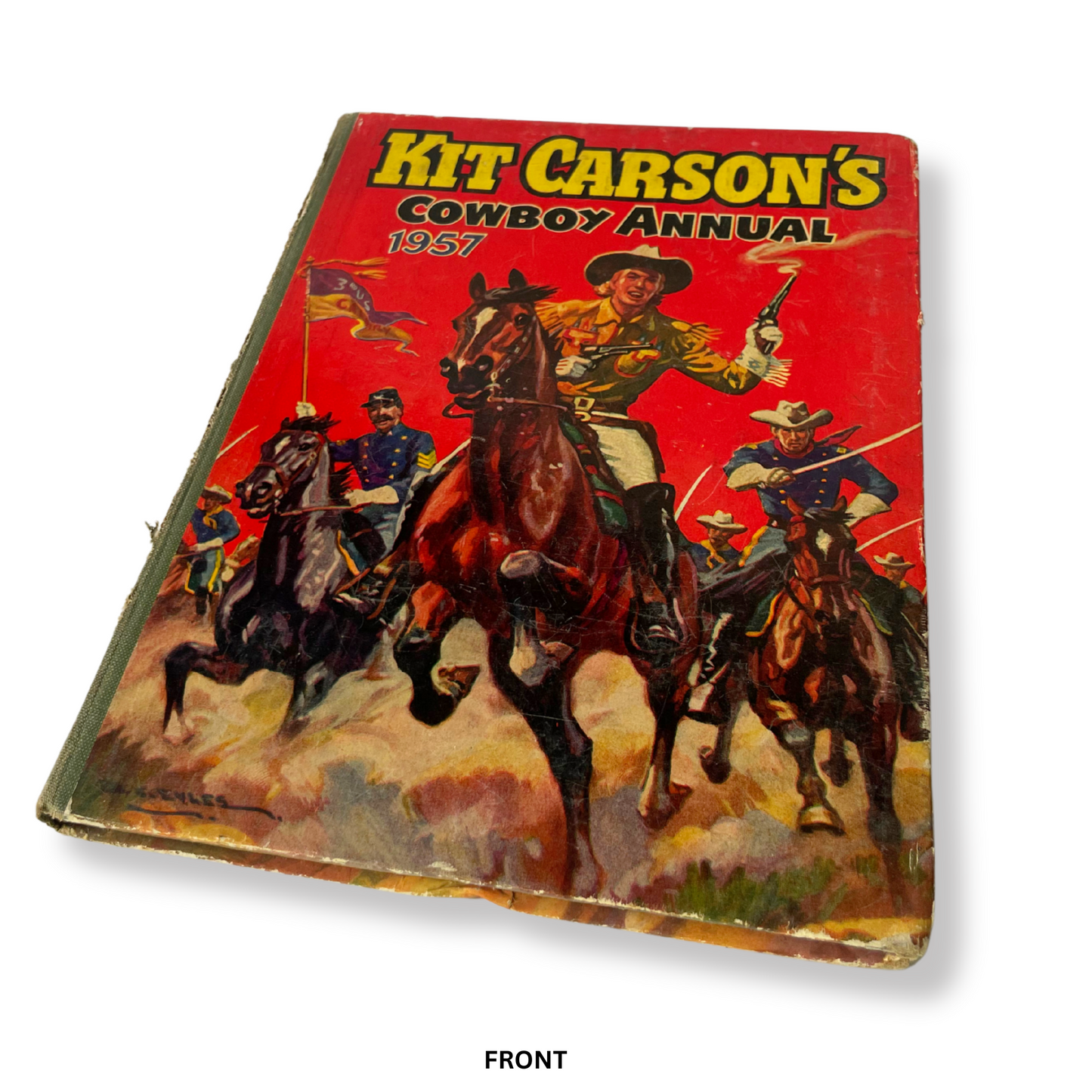 Vintage book cover of 'Kit Carson's Cowboy Annual 1957' with illustrations of cowboys on horseback.