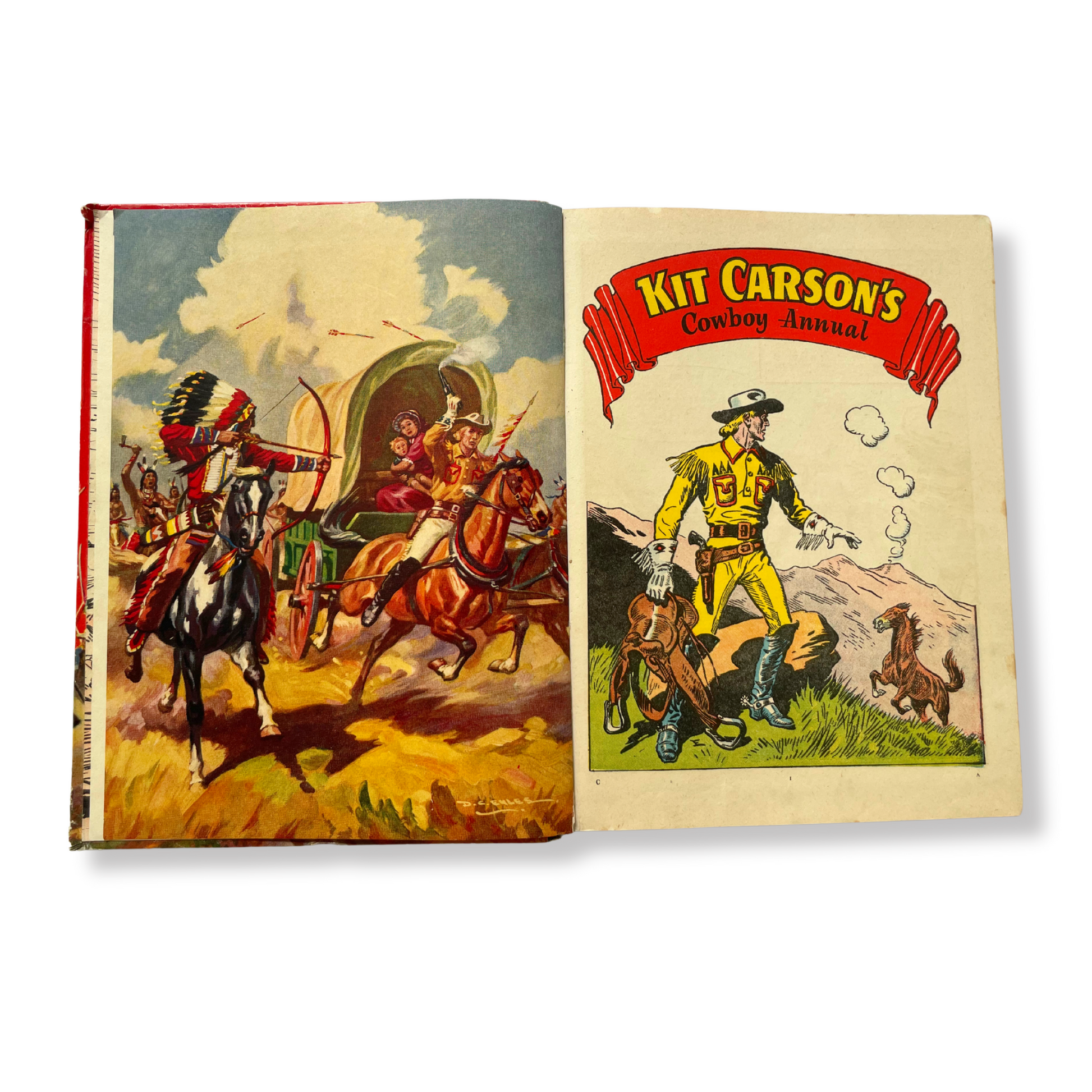 Open book with illustrations of Kit Carson and Native Americans on horseback, featuring the title 'Kit Carson's Cowboy Annual'.